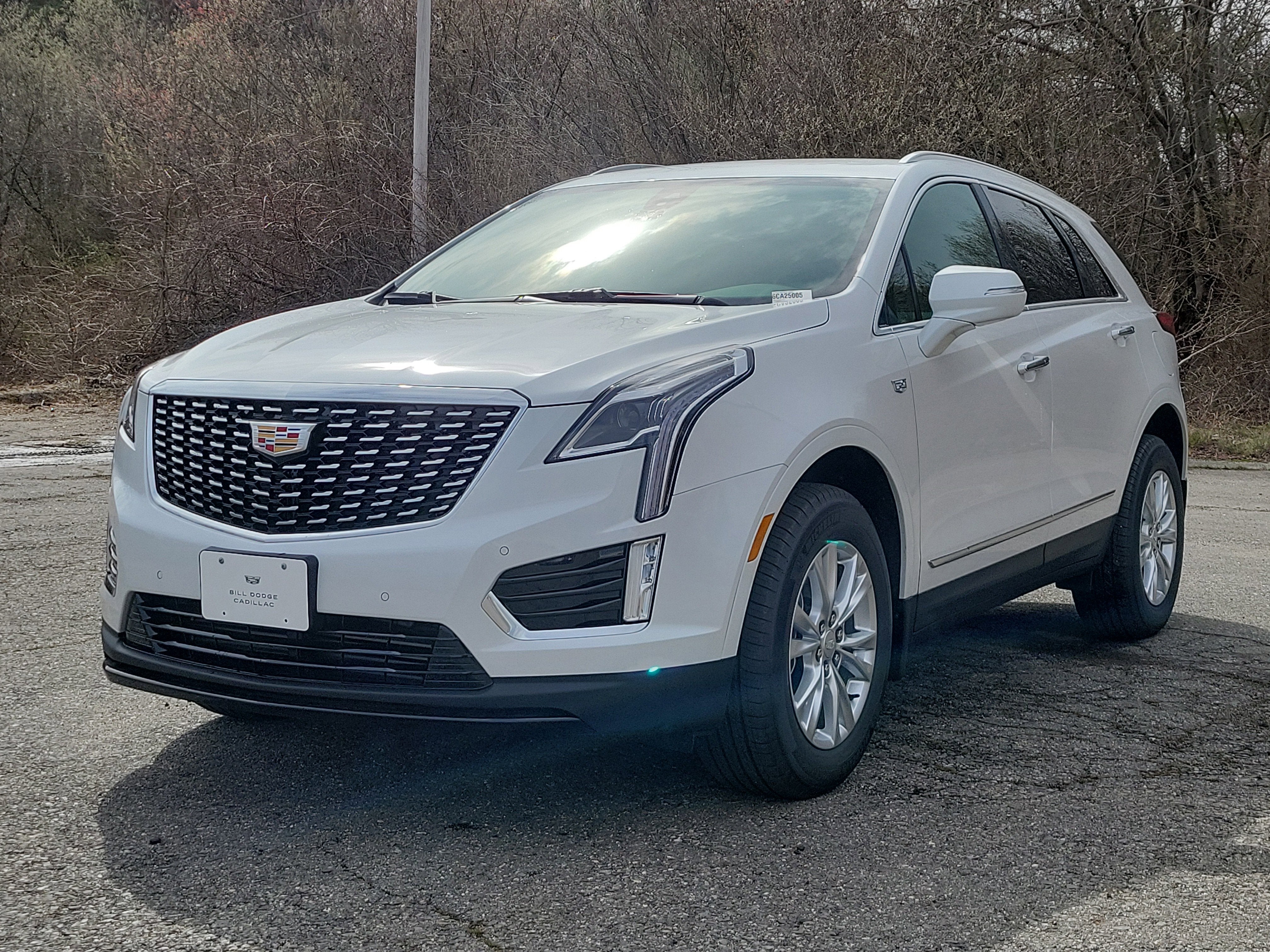 2026 Cadillac XT5 Luxury in Crystal White Tricoat — front three-quarter view
