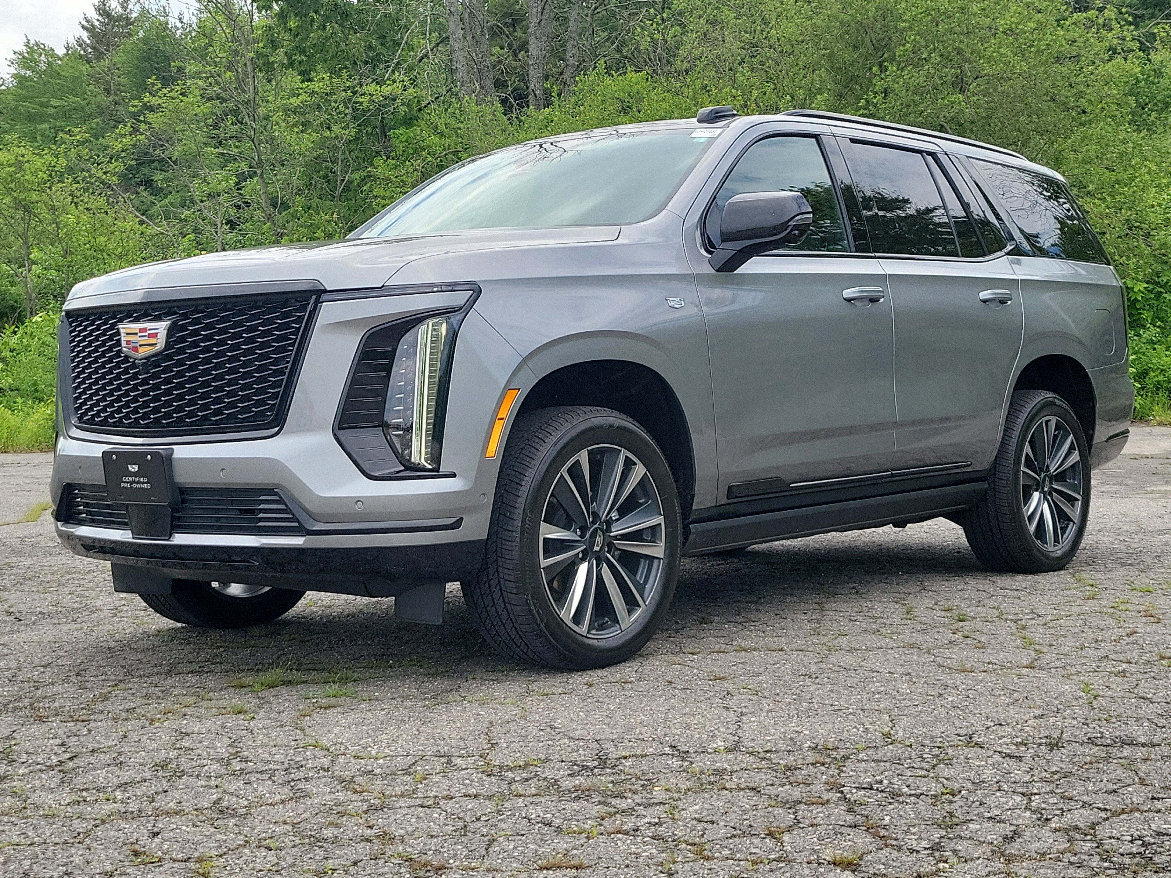 2026 Cadillac Escalade Sport in Argent Silver Metallic — front three-quarter view